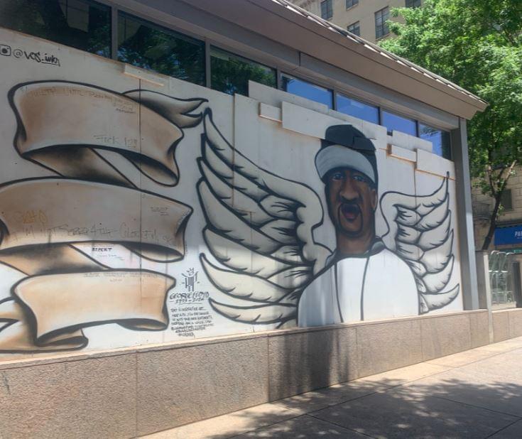 Artwork Painted on Boarded Store Front Windows in Dallas Show Signs of a Positive Future