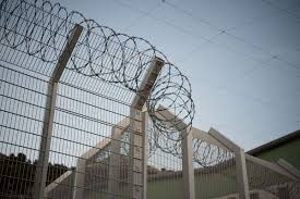 Federal Prison Inmates Charged With Murder
