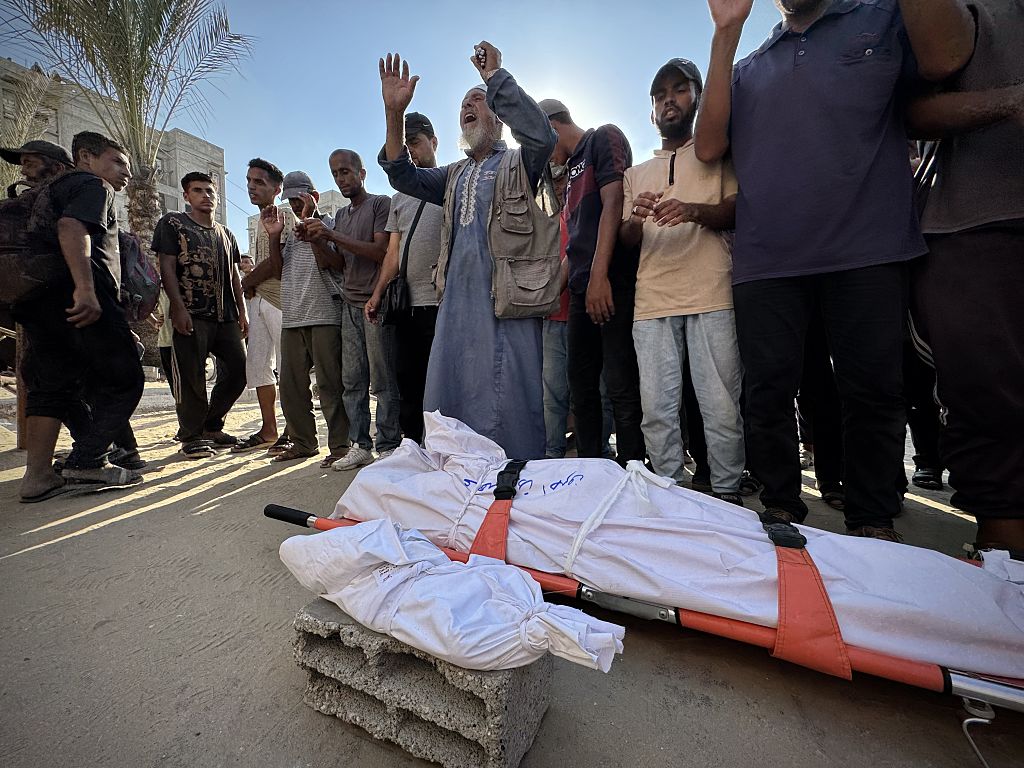 Israeli Fire Kills Dozens In Gaza, Officials Say, As Aid Delivery Remains Chaotic After New Measures