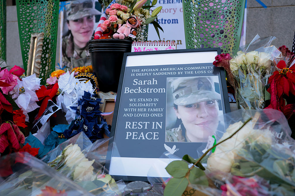 Man Charged in National Guard Shooting Pleads Not Guilty During Court Appearance From Hospital Bed