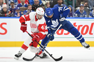 Oct. 5, 2023 ~ Detroit Red Wings defenseman Shayne Gostisbehere (41) battles for the puck with Toronto Maple Leafs forward Ryan Reaves (75) in the third period at Scotiabank Arena. Photo: Dan Hamilton ~ USA TODAY Sports