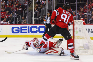 Oct. 14, 2023 ~ Detroit Red Wings goaltender Ville Husso (35) makes a save on New Jersey Devils center Dawson Mercer (91) during the second period at Prudential Center. Photo: Ed Mulholland ~ USA TODAY Sports