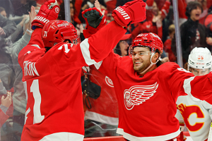 Oct. 22, 2023 ~ Detroit Red Wings center Dylan Larkin (71) celebrates with right wing Alex DeBrincat (93) after scoring in the second period against the Calgary Flames at Little Caesars Arena. Photo: Rick Osentoski ~ USA TODAY Sports