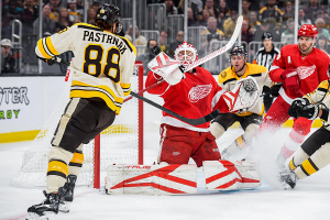 Oct. 26, 2023 ~ Detroit Red Wings goaltender Ville Husso (35) makes a save in front of Boston Bruins right wing David Pastrnak (88) during the first period at TD Garden. Photo: Bob DeChiara ~ USA TODAY Sports
