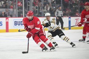 Nov. 4, 2023 ~ Detroit Red Wings defenseman Jake Walman (96) and Boston Bruins right wing David Pastrnak (88) battle for the puck during the first period at Little Caesars Arena. Photo: Tim Fuller ~ USA TODAY Sports