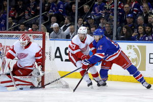 Nov. 7, 2023 ~ New York Rangers center Nick Bonino (12) takes a shot against Detroit Red Wings goaltender Ville Husso (35) and left wing J.T. Compher (37) during the first period at Madison Square Garden. Photo: Brad Penner ~ USA TODAY Sports