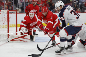 Nov. 11, 2023 ~ Detroit Red Wings defenseman Ben Chiarot (8) and Columbus Blue Jackets center Boone Jenner (38) battle for the puck in front of Detroit goaltender Ville Husso (35) in the third period at Little Caesars Arena. Photo: Rick Osentoski ~ USA TODAY Sports
