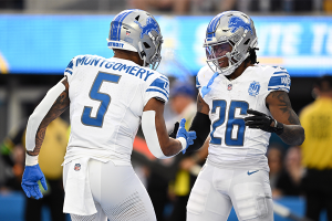 Nov. 12, 2023 ~ Detroit Lions running back Jahmyr Gibbs celebrates with running back David Montgomery after scoring a touchdown against the Los Angeles Chargers during the first half at SoFi Stadium. Photo: Orlando Ramirez ~ USA TODAY Sports