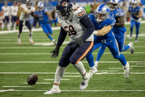 Nov. 19, 2023 ~ Detroit Lions defensive end Aidan Hutchinson (97) and Chicago Bears offensive tackle Darnell Wright (58) chase after the loose ball late in the fourth quarter at Ford Field. Photo: David Reginek ~ USA TODAY Sports