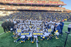 Nov. 18, 2023 ~ Michigan Wolverines celebrate the 1000th win in program history after the game against the Maryland Terrapins at SECU Stadium. Photo: Brad Mills ~ USA TODAY Sports