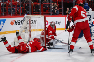 Nov. 17, 2023 ~ Detroit Red Wings defenseman Jake Walman (96) falls next to Detroit Red Wings goaltender Alex Lyon (34) and is injured on a play against the Toronto Maple Leafs during a Global Series NHL hockey game at Avicii Arena. Photo: Per Haljestam ~ USA TODAY Sports