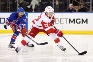Nov. 29, 2023 ~ Detroit Red Wings left wing Lucas Raymond (23) skates with the puck against New York Rangers center Vincent Trocheck (16) during the second period at Madison Square Garden. Photo: Brad Penner ~ USA TODAY Sports