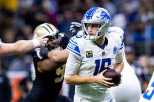 Dec. 3, 2023 ~ Detroit Lions quarterback Jared Goff (16) rolls out the pocket to pass the ball against the New Orleans Saints during the second half at the Caesars Superdome. Photo: Stephen Lew ~ USA TODAY Sports