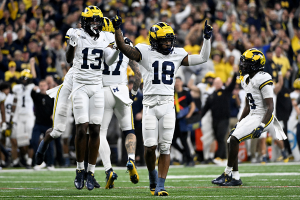 Dec. 2, 2023 ~ Michigan Wolverines defensive back Ja'Den McBurrows (18) and defensive back DJ Waller Jr. (13) celebrate after a turnover during the second half of the Big Ten Championship game against the Iowa Hawkeyes at Lucas Oil Stadium. Photo: Robert Goddin ~ USA TODAY Sports