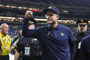 Dec. 2, 2023 ~ Michigan football coach Jim Harbaugh waves at fans after the Wolverines' 26-0 win over Iowa in the Big Ten championship game in Indianapolis. Photo: Junfu Han ~ USA TODAY NETWORK