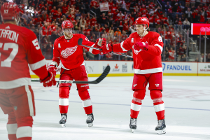 Dec. 7, 2023 ~ Detroit Red Wings defenseman Ben Chiarot (8) fist bumps center Andrew Copp (18) after scoring a goal in the second period at Little Caesars Arena. Photo: Brian Bradshaw Sevald ~ USA TODAY Sports