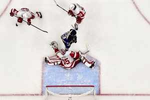 Dec. 12, 2023 ~ Detroit Red Wings goaltender Ville Husso (35) makes a glove save in front of St. Louis Blues left wing Jake Neighbours (63) during the third period at Enterprise Center. Photo: Jeff Curry ~ USA TODAY Sports