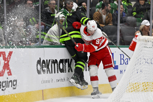 Dec. 11, 2023 ~ Detroit Red Wings right wing Alex DeBrincat checks Dallas Stars defenseman Miro Heiskanen during the third period at the American Airlines Center. Photo: Jerome Miron ~ USA TODAY Sports