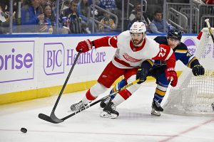 Dec. 12, 2023 ~ Detroit Red Wings center Michael Rasmussen (27) and St. Louis Blues defenseman Scott Perunovich (48) battle for the puck during the first period at Enterprise Center. Photo: Jeff Curry ~ USA TODAY Sports