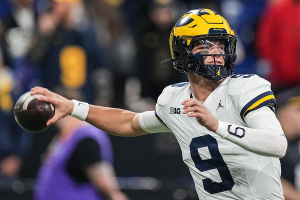 Dec. 2, 2023 ~ Michigan Wolverines quarterback J.J. McCarthy warms-up on the field during the game at Lucas Oil Stadium in Indianapolis. Photo: Grace Hollars ~ USA TODAY NETWORK