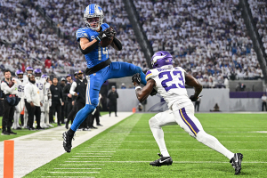 Dec. 24, 2023 ~ Detroit Lions wide receiver Amon-Ra St. Brown (14) catches a pass as Minnesota Vikings cornerback Andrew Booth Jr. (23) defends during the game at U.S. Bank Stadium. Photo: Jeffrey Becker ~ USA TODAY Sports