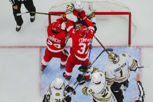 Dec. 31, 2023 ~ Detroit Red Wings left wing J.T. Compher (37) and right wing Alex DeBrincat (93) scuffle with Boston Bruins defenseman Charlie McAvoy (73) in front of the net during the game between the Boston Bruins and the Detroit Red Wings at Little Caesars Arena. Photo: Brian Bradshaw Sevald ~ USA TODAY Sports