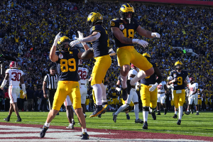 Jan. 1, 2024 ~ Michigan Wolverines running back Blake Corum (2) celebrates with tight ends Colston Loveland (18) and AJ Barner (89) after scoring a touchdown against the Alabama Crimson Tide during the first half in the 2024 Rose Bowl college football playoff semifinal game at Rose Bowl. Photo: Kirby Lee ~ USA TODAY Sports