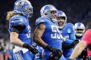 Jan. 21, 2024 ~ Lions linebacker Derrick Barnes, center, celebrates an interception from Buccaneers quarterback Baker Mayfield with linebackers Alex Anzalone, left, and Jalen Reeves-Maybin during the second half of the Lions’ 31-23 win at Ford Field. Photo: Junfu Han / USA Today Network