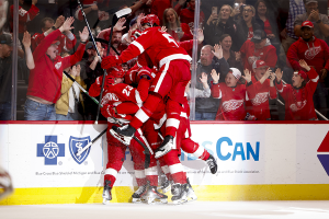 April 15, 2024 ~ Detroit Red Wings left wing Lucas Raymond receives congratulations from teammates after he scores in overtime against the Montreal Canadiens at Little Caesars Arena. Photo: Rick Osentoski ~ USA TODAY Sports