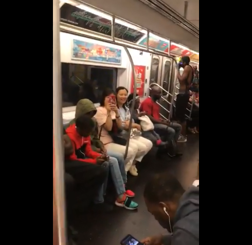 Strangers break out into a subway singalong