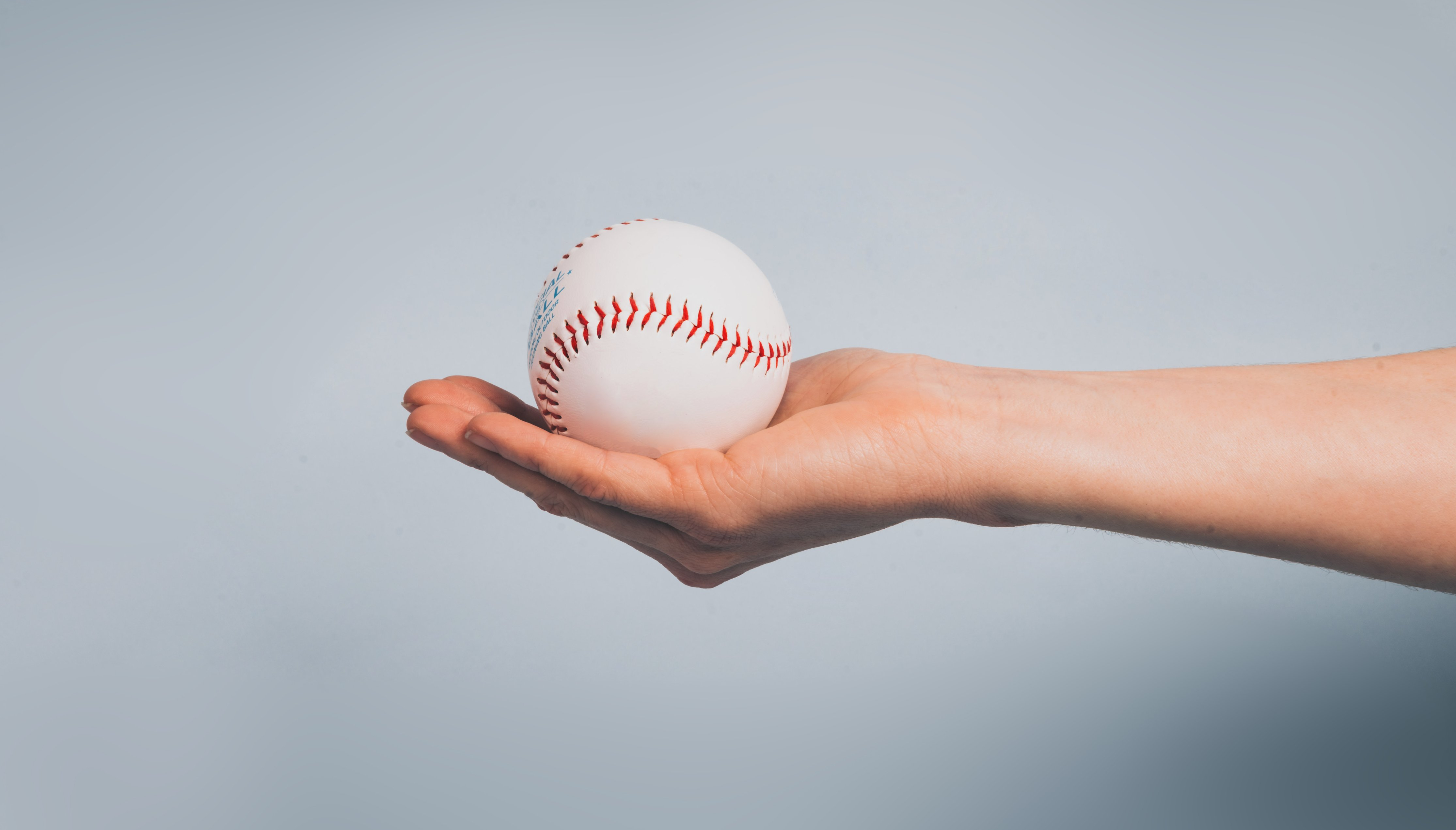 A man at the All-Star game pushes kids for a baseball autograph