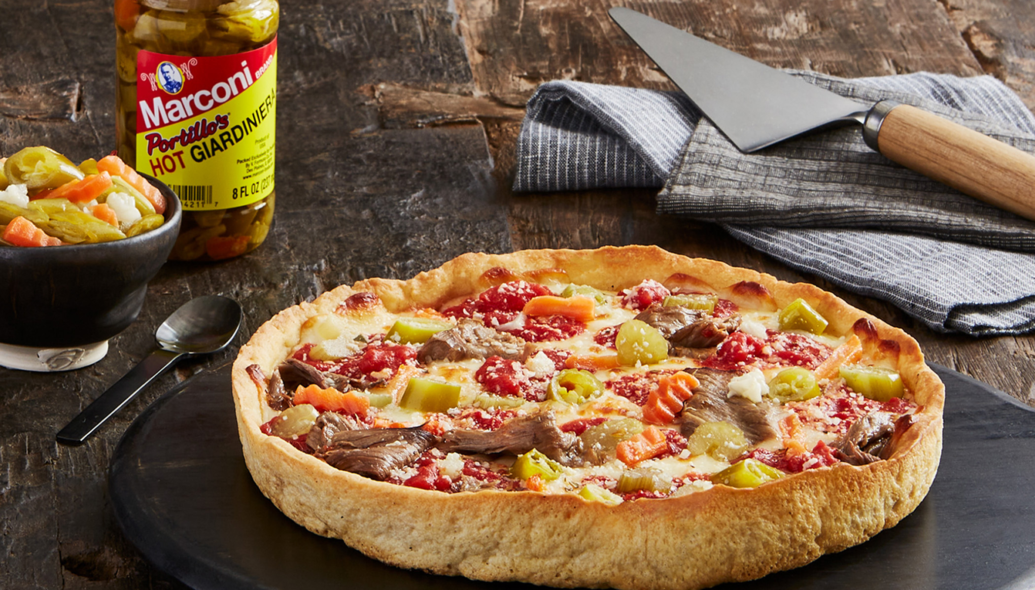 Lou Malnati’s and Portillo’s made a baby called “Italian Beef Deep Dish Pizza”