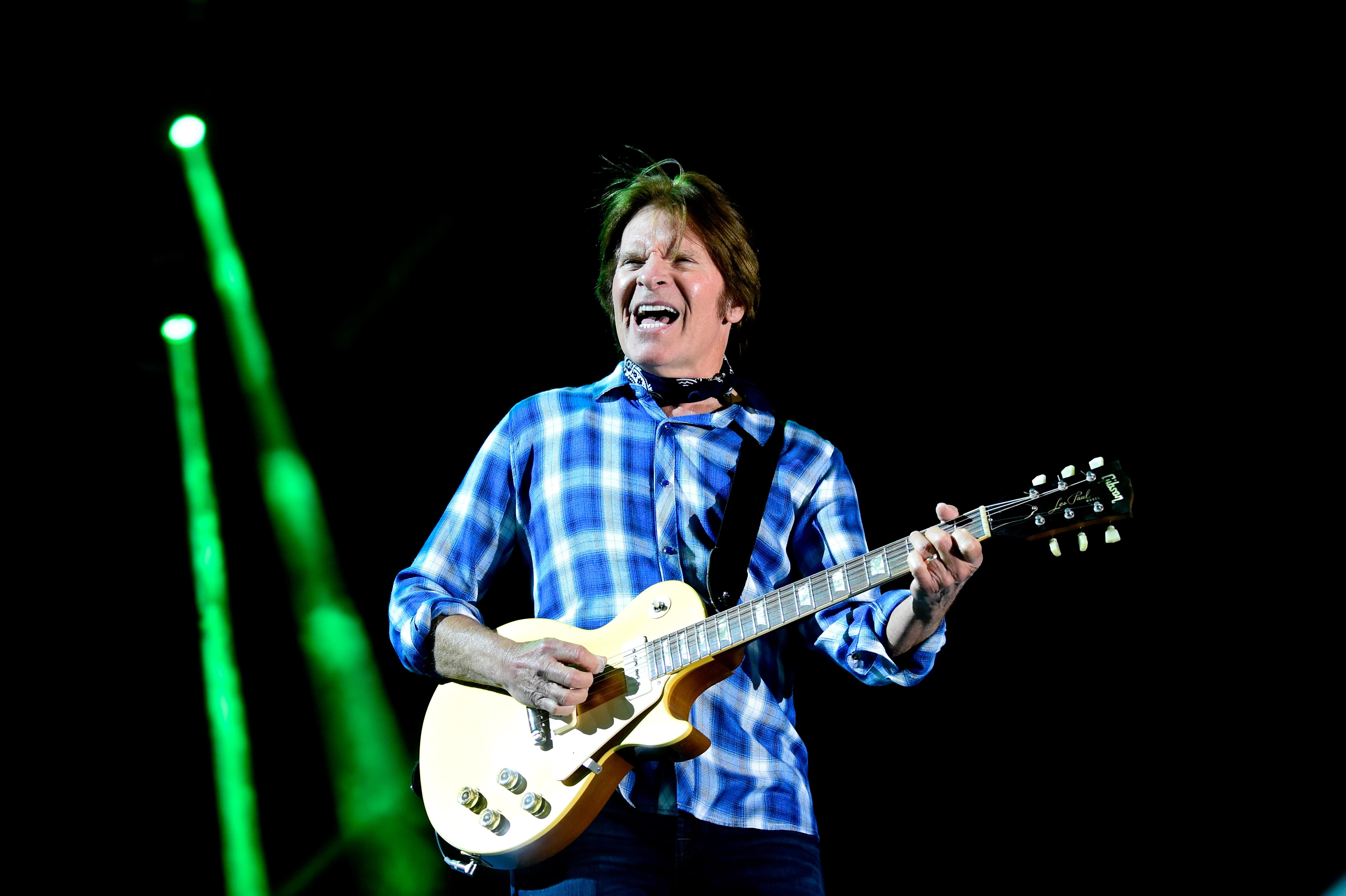 John Fogerty uses check from canceled Woodstock 50th to build a house for a veteran