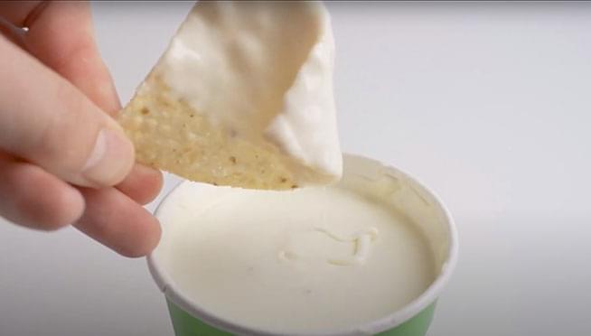 You can watch 8 hours of a Moe’s Tortilla Chip getting dipped into queso