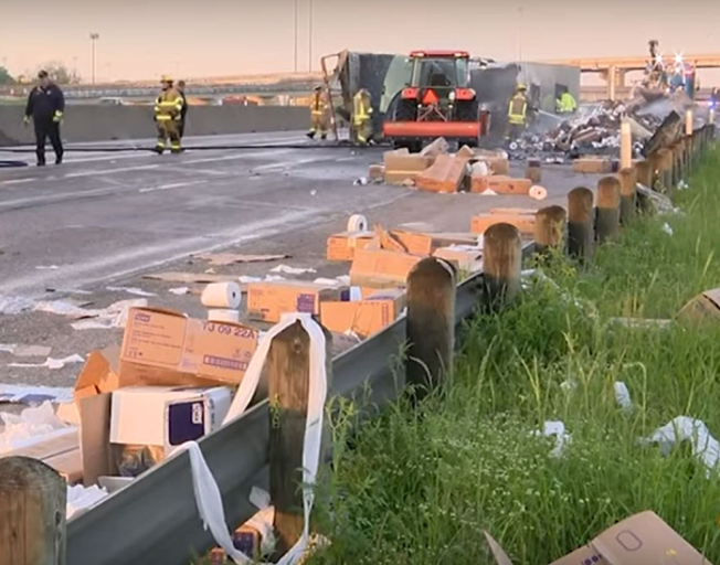 Toilet paper truck crashes, burns, load rolls across road