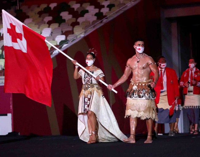 The Shirtless Tongan Flag-Bearer Is Back