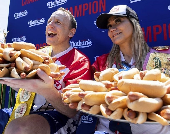 Joey Chestnut Wins Hot Dog Eating Contest While Wrestling A Protestor