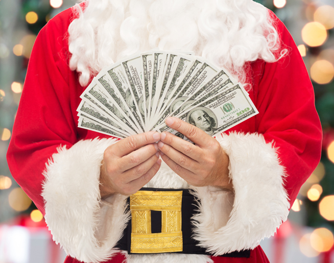 christmas, holidays, winning, currency and people concept - close up of santa claus with dollar money over tree lights background