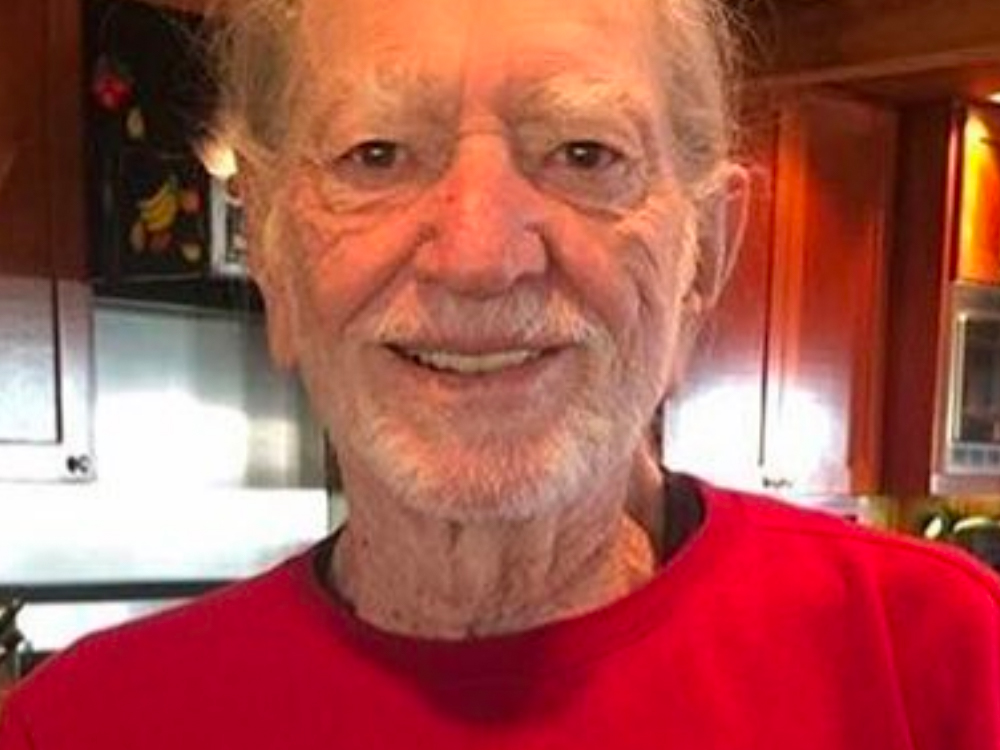 Why Is Willie Nelson So Happy? Because He Got the Dopest Christmas Sweater Ever From Snoop Dogg