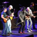Eddie Montgomery and Montgomery Gentry band members on stage.