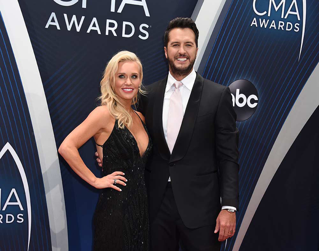 Caroline and Luke Bryan on the Red Carpet at the 52nd CMA Awards in 2018.