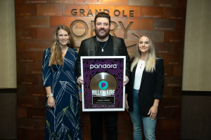 Chris Young holding plaque