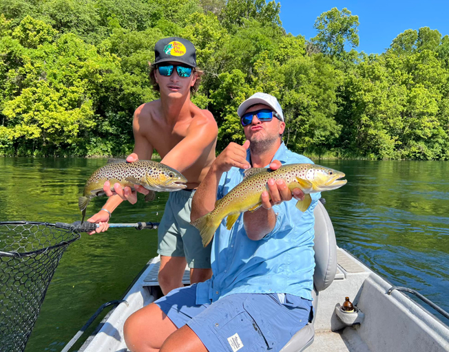 Luke Bryan and one of his boys fishing