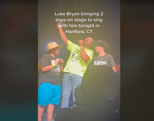 Luke Bryan Brings Two Young Boys Onstage To Honor Their Late Father With “Drink A Beer”