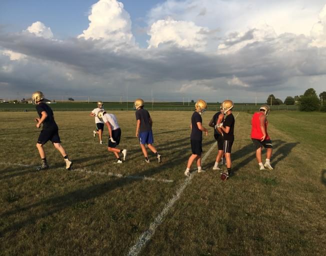 Helmets on as high school football practices begin