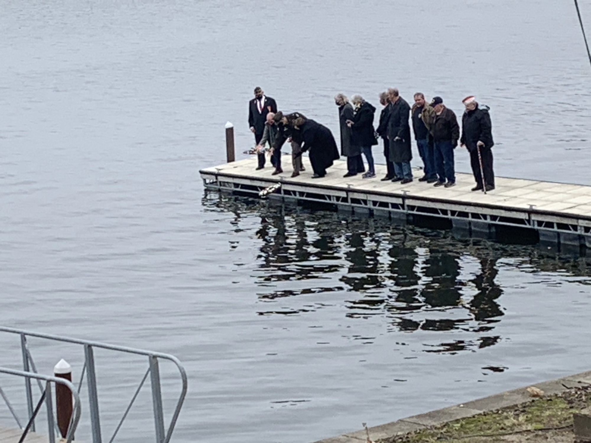 Bloomington man helps with a wreath-tossing ceremony in Springfield observance of Pearl Harbor