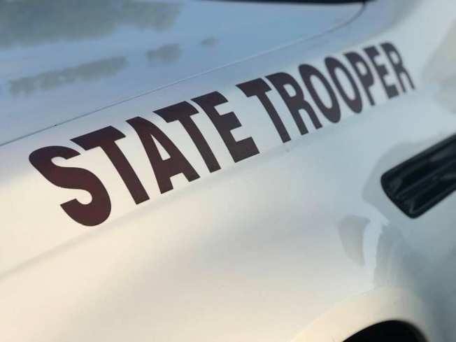 One dead after passenger vehicle collides with two semis on Interstate 55