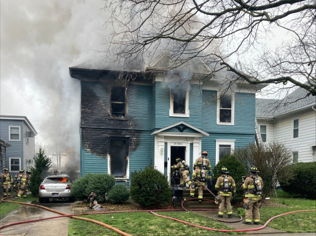 One person sent to hospital after mid-day house fire in Bloomington
