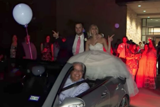 Watch This Newlywed Couple Fall Off the Back of a Convertible [VIDEO]