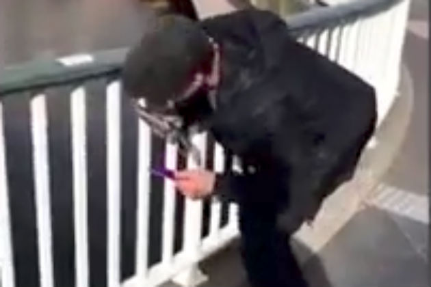 This Drunk Guy Mistakes a Fence For an ATM Machine [VIDEO]